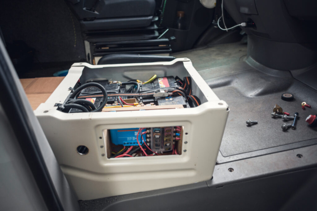 Electronics build into the front seat of a camper van Split Chargers