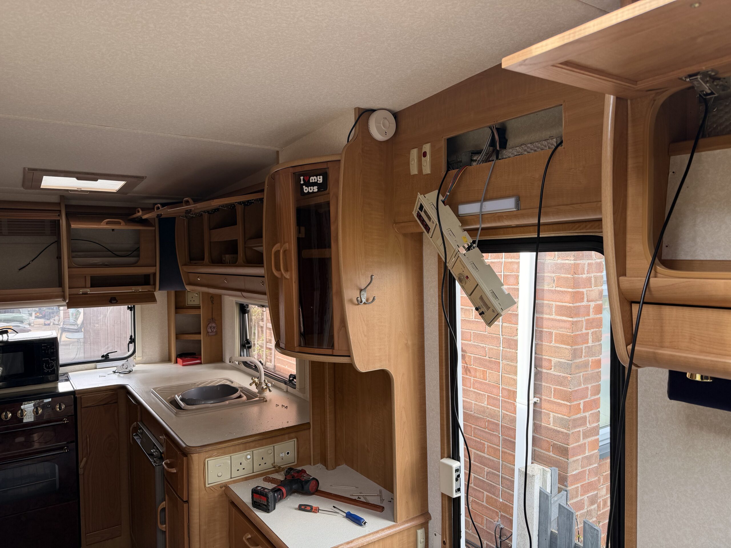 AutoTrail motorhome reversing camera wiring being routed through interior during installation