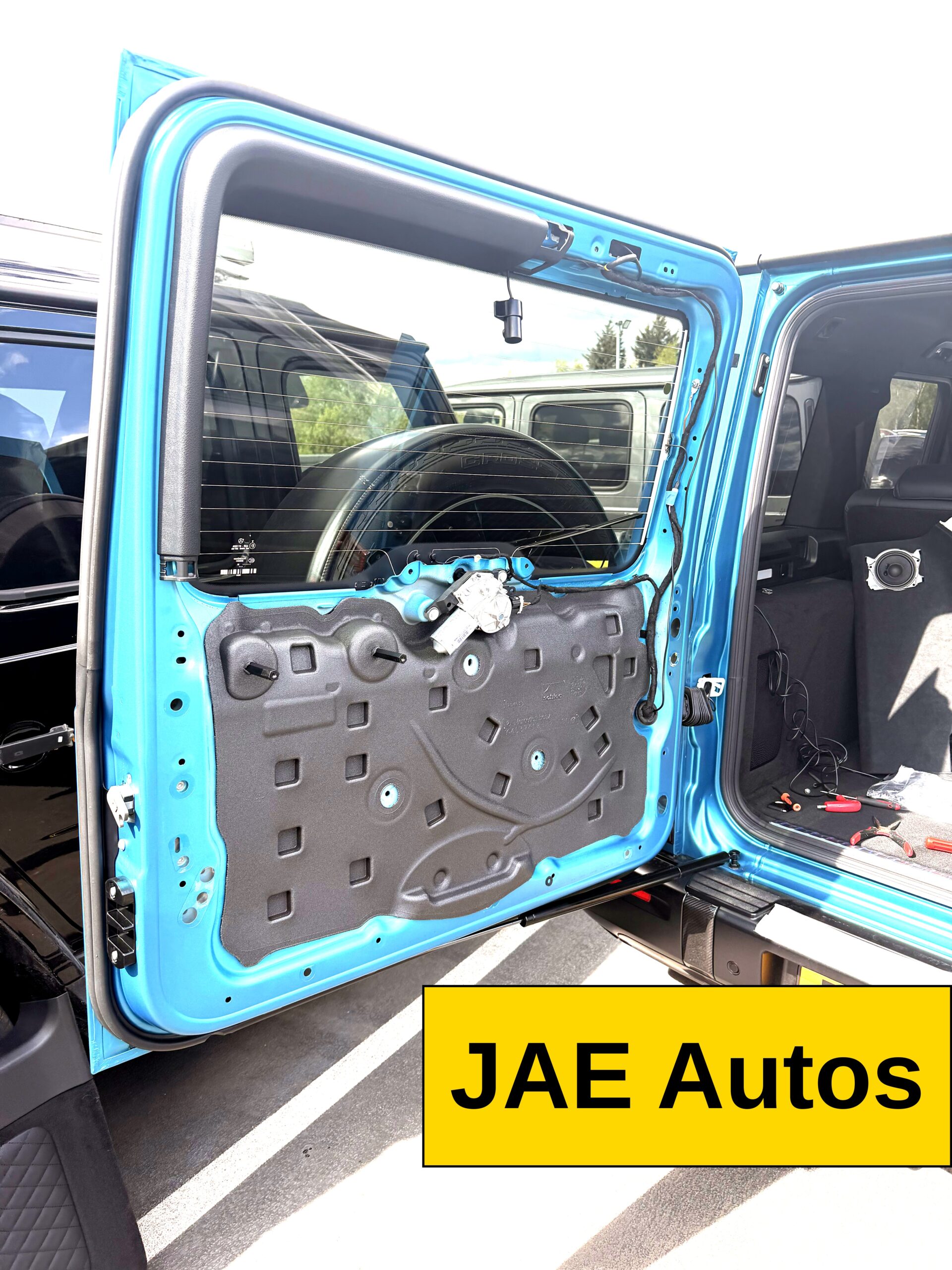 G Wagon door panel removed for hidden tracker wiring — professional install by JAE Autos